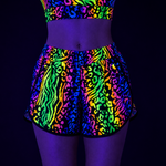 multicoloured animal print UV shorts and top outfit show under black light