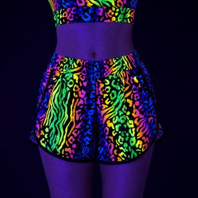 multicoloured animal print UV shorts and top outfit show under black light