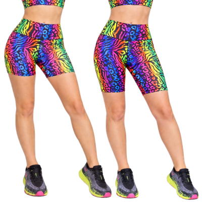 Two pairs of colorful zebra-patterned shorts on a white background