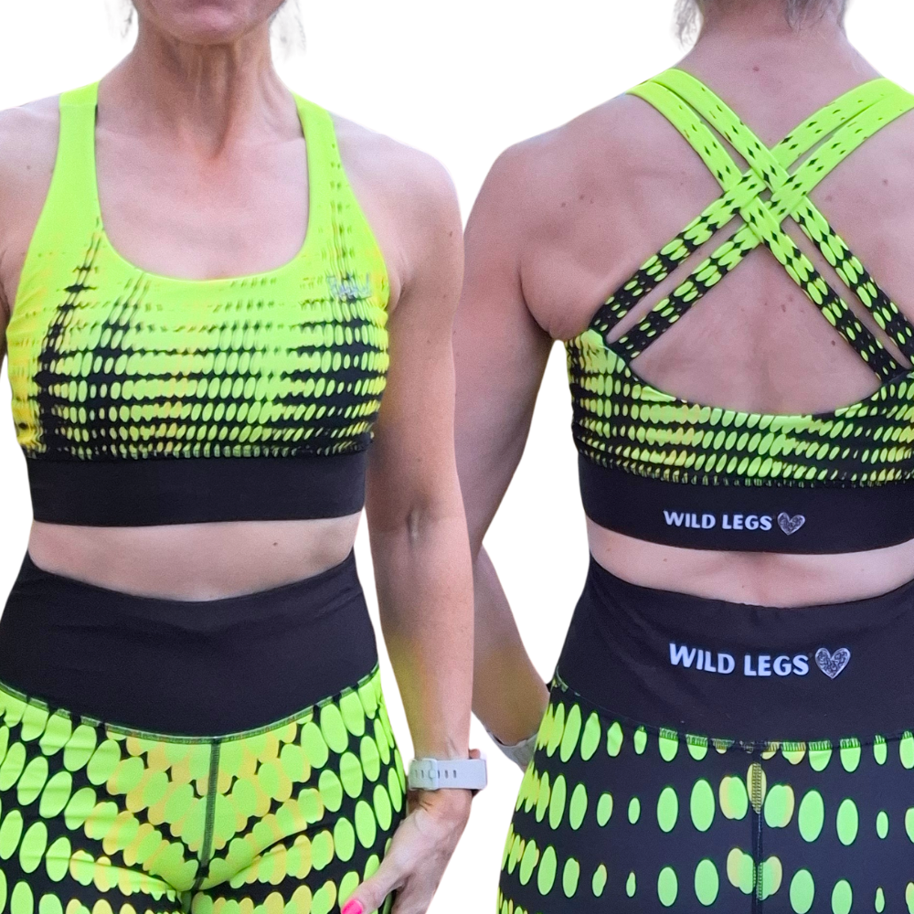 Neon yellow and black sports bra and leggings set with 'Wild Legs' branding.