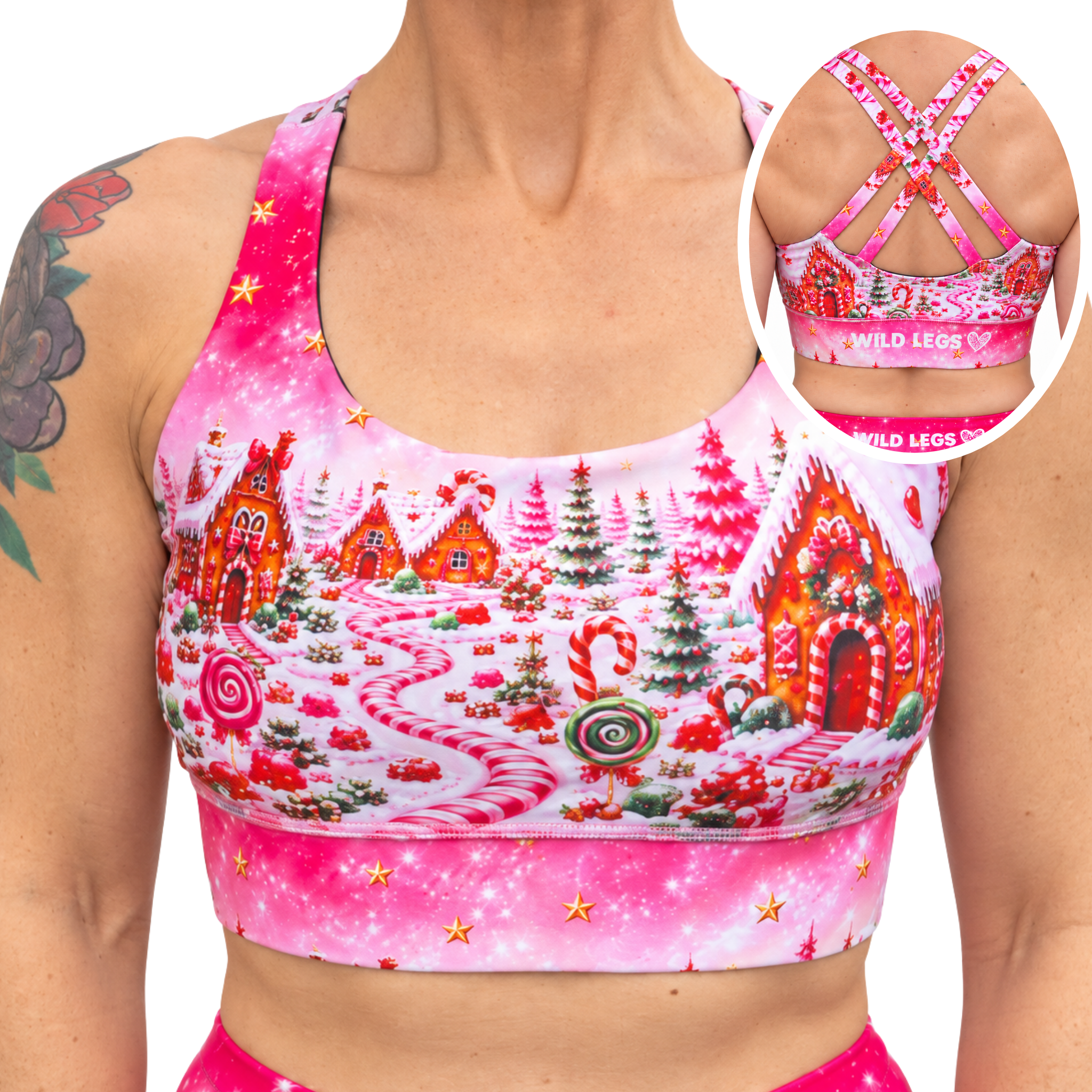 A woman wearing a pink sports bra with a colorful gingerbread village print, shown from the chest down with a circular inset highlighting the back straps and band text that reads 'WILD LEGS'.