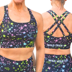Sports bra and shorts set with star pattern and 'Wild Legs' branding on a white background