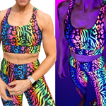 Colorful sports bra and leggings with zebra and leopard print under UV light.