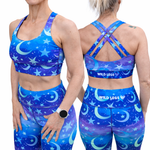 Blue athletic outfit with star and moon pattern, featuring 'Wild Legs' branding, shown from front and back.
