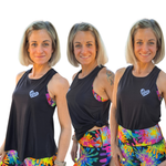 woman wearing a black tank with a white heart logo in three different styles with bright leggings