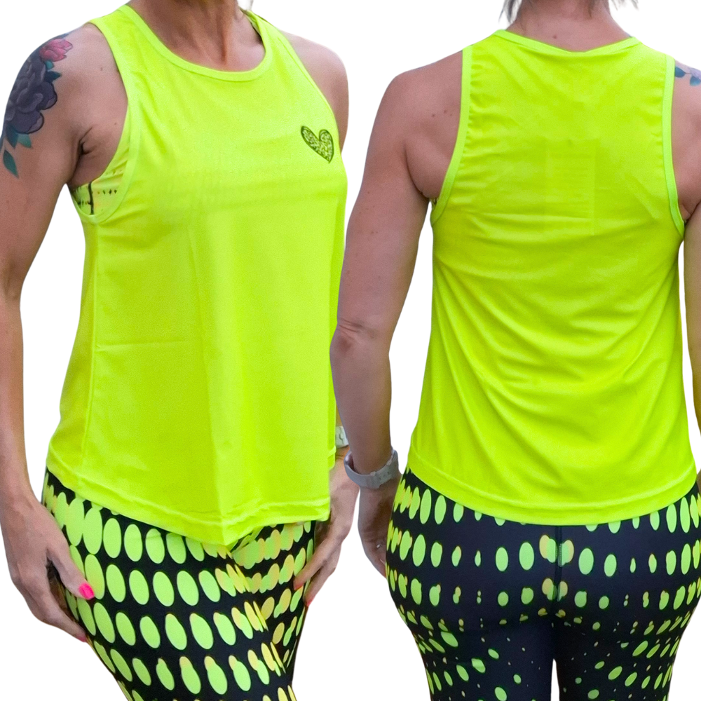 Neon yellow tank top with matching leggings on a person against a white background