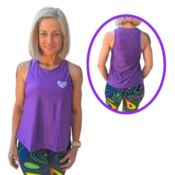 Woman wearing a purple tank top with a heart design and colorful leggings, with a close-up of the back of the tank top.