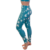 blue fitness leggings with white butterflies on a white background from the side