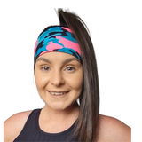 woman wearing a pink and turquoise headband on a white background