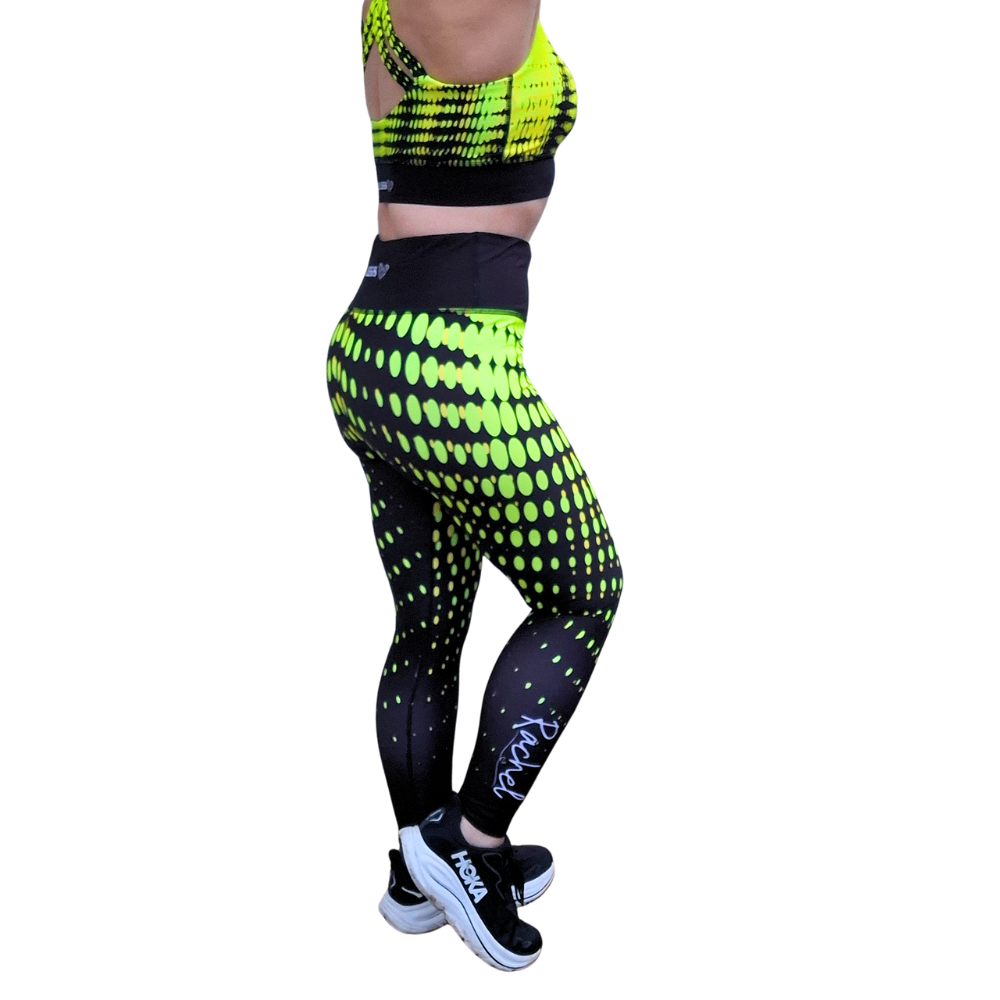 Neon yellow and black patterned leggings with a white background