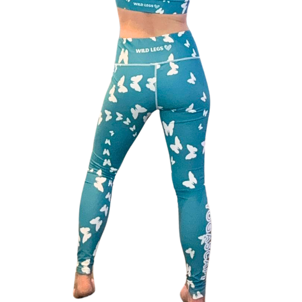 Teal leggings with white butterfly pattern on a white background