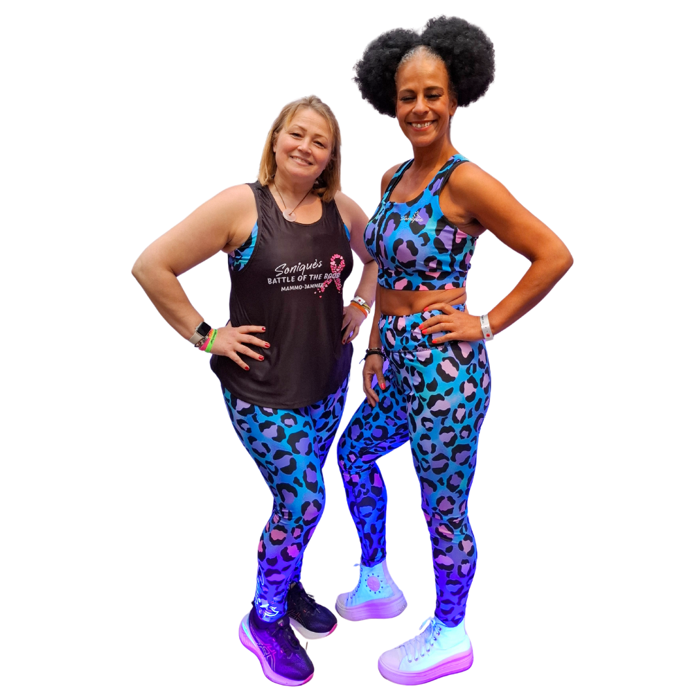 Two women wearing matching blue and purple leopard print outfits on a white background