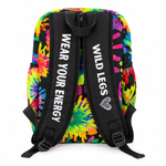 Colorful tie-dye backpack with 'Wear Your Energy' and 'Wild Legs' text on a white background