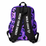 Purple backpack with black leopard print pattern and 'Wild Legs' branding on a white background