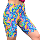 mid length colourful rainbow fitness shorts on a white background
