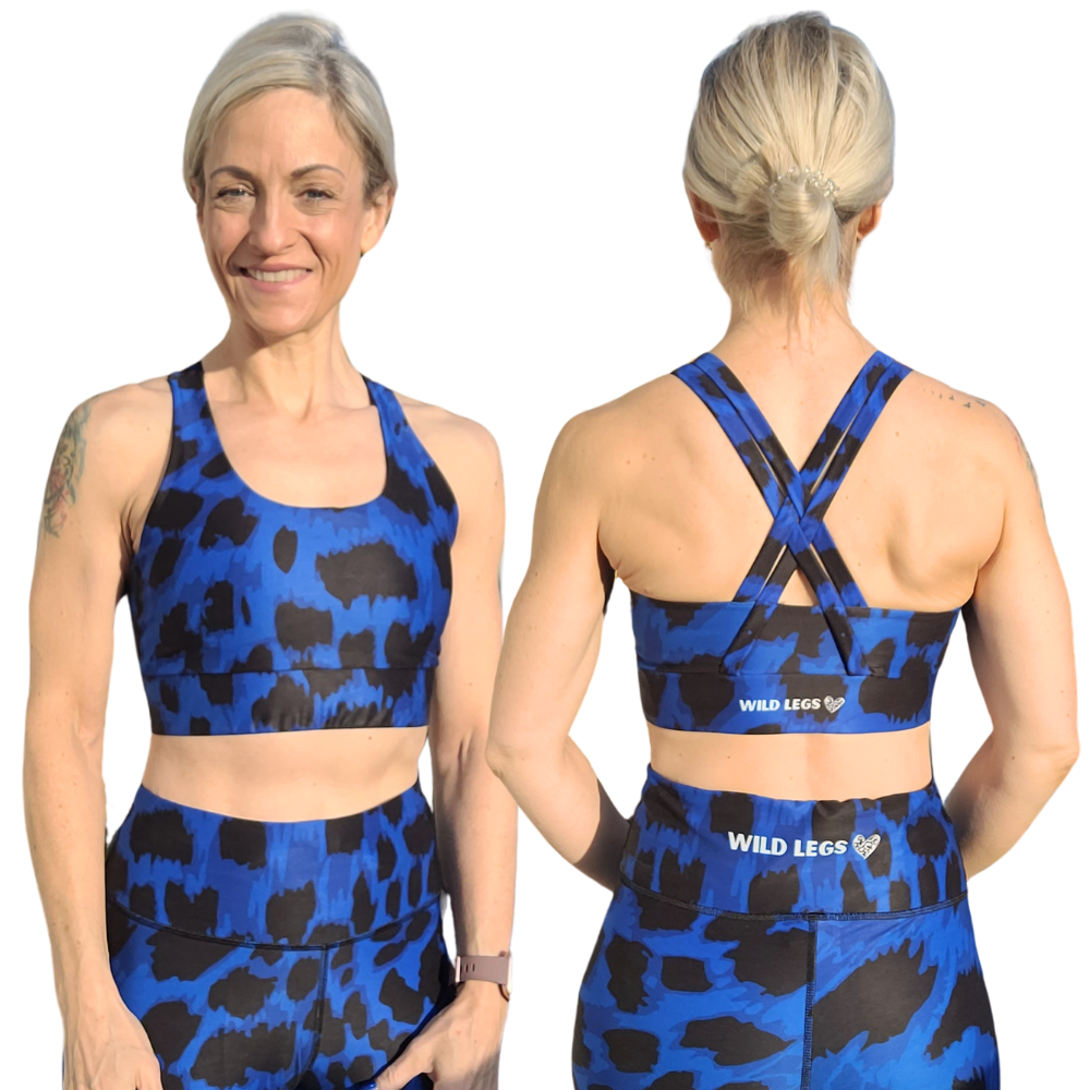 Woman wearing a blue and black animal print patterned sports bra and leggings set, showing front and back views.